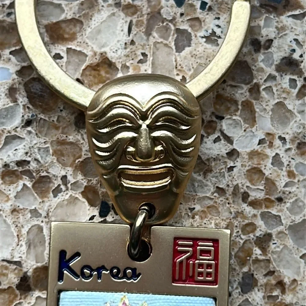 Gold Tone Korean Mask Keychain with Flower 🌺 Tag In Box 🗃️ engraved Korea back